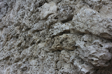 porous gray stone wall