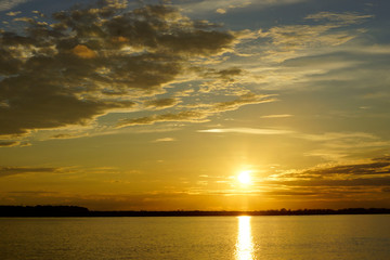 Obraz premium sunset over the river