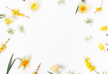 Spring frame of small flowers and daffodils, floral arrangement