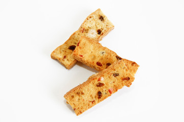 white bread crackers with fruit slices on a white background