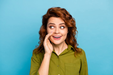 Portrait of enthusiastic energetic woman look copyspace share private novelty her friend enjoy rejoice wear stylish trendy clothes isolated over blue color background