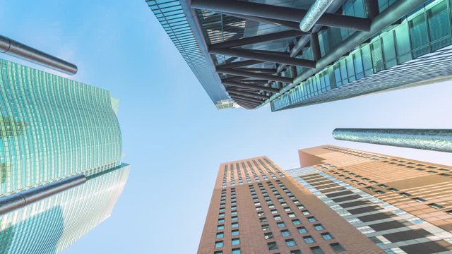 Downtown Tokyo time lapse view, looking up at office building architecture in the financial district of Tokyo in Japan,City of life concept