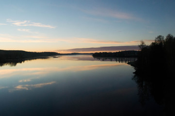 Naklejka na ściany i meble Scenic View Of Calm Lake At Sunset
