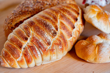 Freshly baked loaf of bread, buns, closeup.