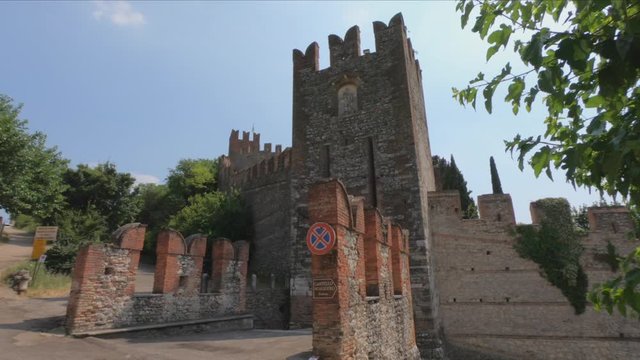 DOLLY SHOT - The Castle of Soave is a typical medieval military castle. In front of the castle is a drawbridge with a gate built in the 15th century, Soave, Italy.