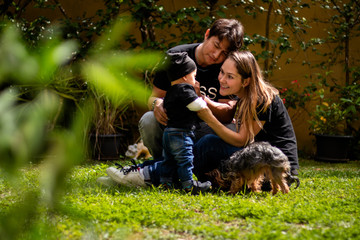 Happy family playing on the garden