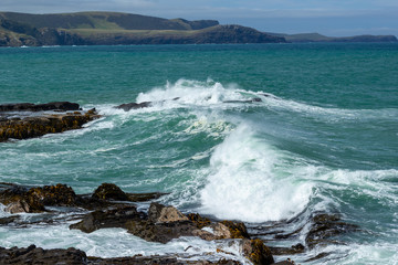 Waves crushing at Rocks in Porpoise Bay of New Zealand on a Stormy Day, Waikawa, New Zealand
