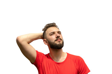 Fototapeta premium handsome young man looking up, smoothing hair isolated on white background. narcissism, sense of superiority