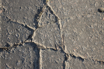 The texture of the broken road. Old building blocks. Background for screensaver monitor