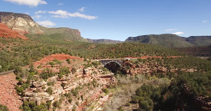 Aerial pull back from  Midgley Bridge which connects Sedona and Flagstaff along route 89A, Sedona, Arizona.