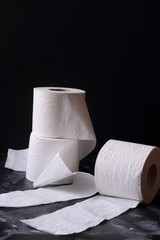 white toilet tissue ,paper on a  black background