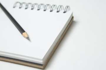 Selective focus of Pencils and notepads  on white background