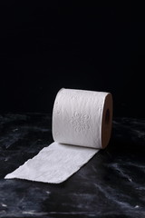 White toilet tissue,paper on a black background
