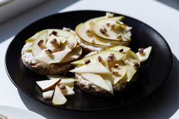 Delicious tartlets or cake with mixed pieces of apples and pears and chocolate from above. Summer pastry desserts
