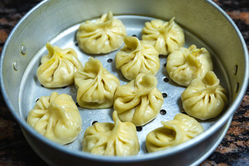 Nepalese traditional dumpling momos, Tibetan momo, Chinese dumpling dimsum on a momo pot