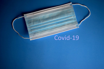 Surgical mask, blue background, protection from dangerous viruses, remedies for your health