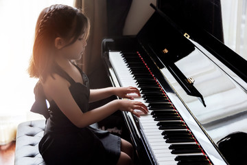 asian girl kids practice play piano © Yanukit