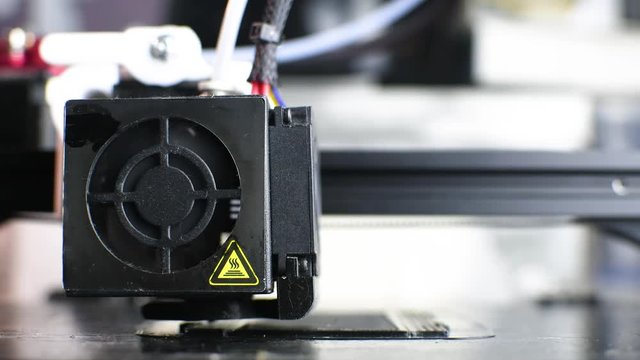 The 3D printer prints the model out of black plastic. Modern techology. 4K