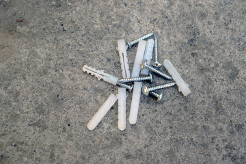 Dowels are randomly located on a concrete surface. View from above.