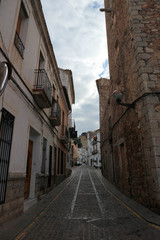 Fototapeta na wymiar on the empty cosy narrow street in the medieval old town of sagunto, Spain