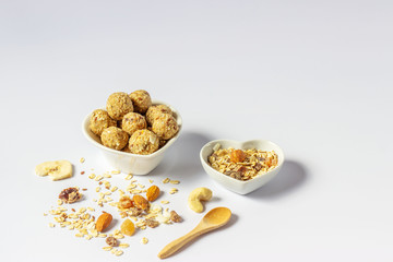 Healthy homemade energy balls with nuts, oats, dried fruit. Vegetarian raw organic food.  Horizontal orientation.