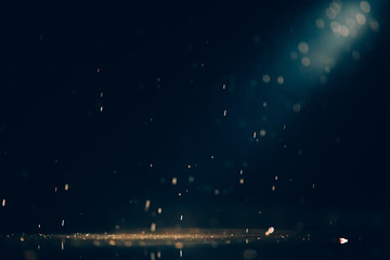 Abstract images of pouring rain in the night.