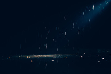 Abstract images of pouring rain in the night.