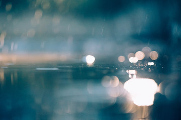 Abstract images of pouring rain in the night.