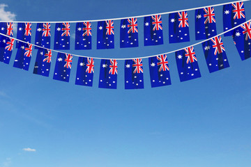 Australia flag festive bunting hanging against a blue sky. 3D Render