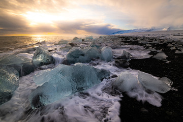 Braking waves at jökulsarlon Diamond beach during sunset - no. 2