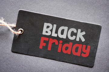 BLACK FRIDAY text on black tag. Concept in business. Forms and great offers on trade.