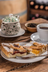 tea with quince cake on wooden table