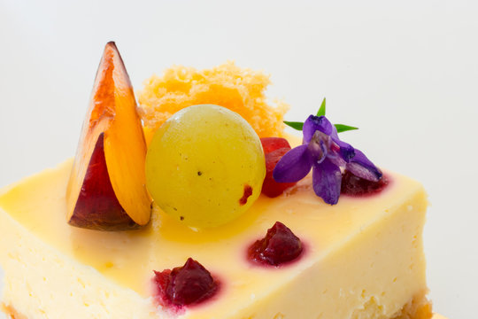 A Nice Cheesecake With Grape, Jam, Flower, And Nectarine.