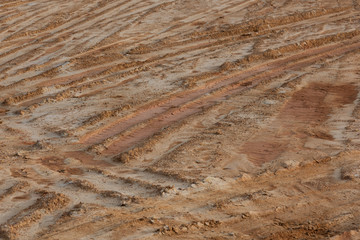 Dried muddy dirt road rut texture