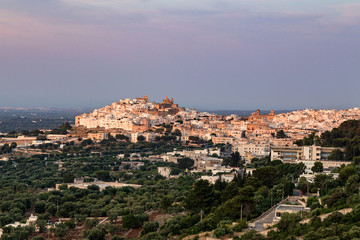 Beautiful view of the city of Ostuni in the sunset rays of the sun. Ostuni, Puglia, Italy