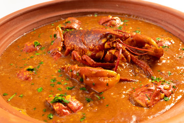 Lobster stew in a clay pot dish. Caldereta de bogavante