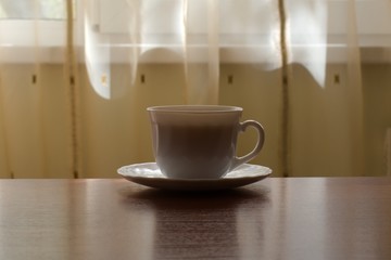 cup of tea on the table on a sunny morning