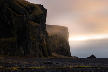Scenic cliffs at Vik i Myrdal during sunrise on a foggy day - no. 1