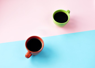 Americano in the different cups on the pink background.