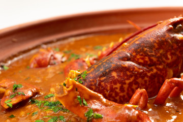 Lobster stew in a clay pot dish. Caldereta de bogavante