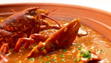 Lobster stew in a clay pot dish. Caldereta de bogavante