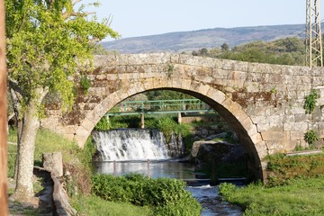 Fototapeta na wymiar Waterfall and Bridge