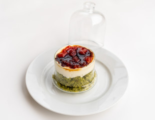 Creamy pie with basil, cheese and tomato jam in a glass. Bizcocho Mediterráneo