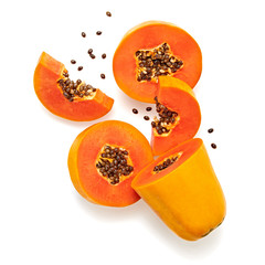 Papaya tropical fruit, slices orange isolated on white. Fruity diet concept. Sweet summer cut fresh papaya background. Colorful orange papaya fruit. Creative summertime design.