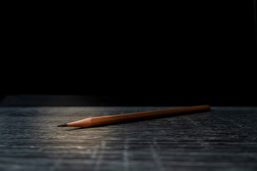 A pencil that stands out from the light and shadow that looks simple but shows strength, endurance,...