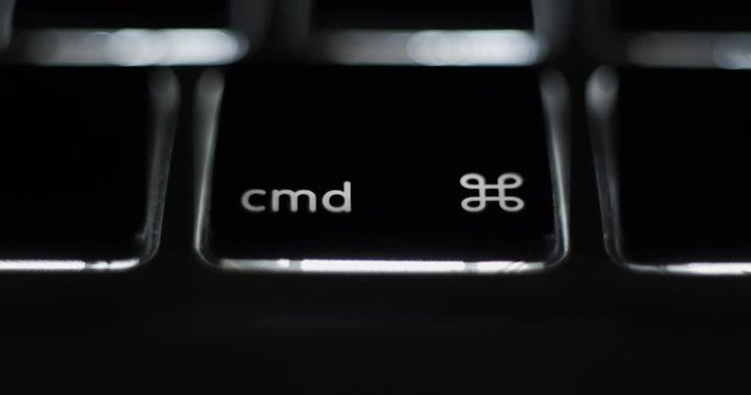Pressing command cmd key on laptop computer keyboard