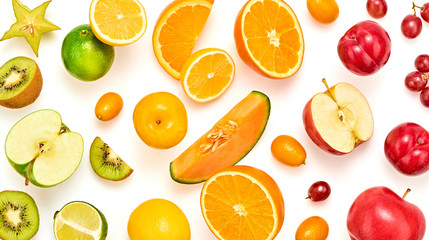 Creative fresh fruits layout. Papaya, apple, orange, kiwi, lemon isolated on white background. Healthy fruity diet concept. Tropical mix background. Colorful summertime fruit flat lay.