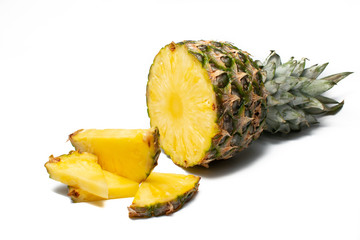 Fresh pineapple on a white background. Sliced exotic fruit waiting to be eaten.