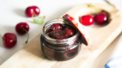 Cherry chutney in a glass pot