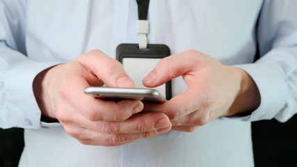 Man using his smartphone. Social network. Close up.